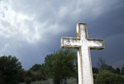 Cross against stormy sky.