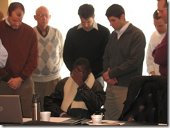 praying with staff