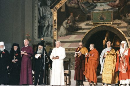 Pope John Paul II attends an interreligious peace meeting in Assisi, Italy, in this Oct. 27, 1986, file photo. Pope Francis will join dozens of religious leaders in Assisi Sept. 20 for an interfaith peace meeting marking the 30th anniversary of the 1986 encounter. Pictured from left are: Metropolitan Filaret of the Russian Orthodox Church; Bishop Gabriel of Palmyra, representing the Greek Orthodox Church of Antioch; Orthodox Archbishop Methodios; Archbishop of Canterbury Robert Runcie, spiritual head of the worldwide Anglican Communion; Pope John Paul II;  the Dalai Lama; Venerable Maha Ghosananda of Cambodia; Venerable Eui-Hyun Seo of Korea; and Venerable Etai Yamada of Japan. (CNS photo/L'Osservatore Romano) See POPE-ASSISI-PEACE Sept. 1, 2016.